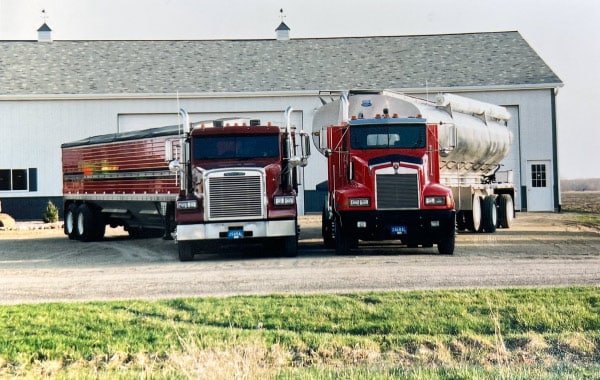 Modern trucking fleet of Willow Creek Farms Trucking delivering reliable regional transportation services in Michigan.